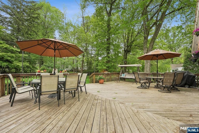 13 Stonewall Dr, Livingston, NJ 07039 - deck with outdoor dining space and view of wooded area