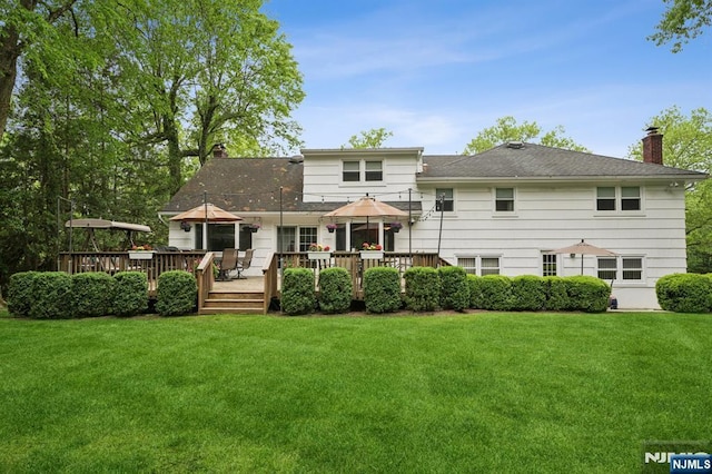 13 Stonewall Dr, Livingston, NJ 07039 - back of property featuring a chimney, a yard, and a wooden deck
