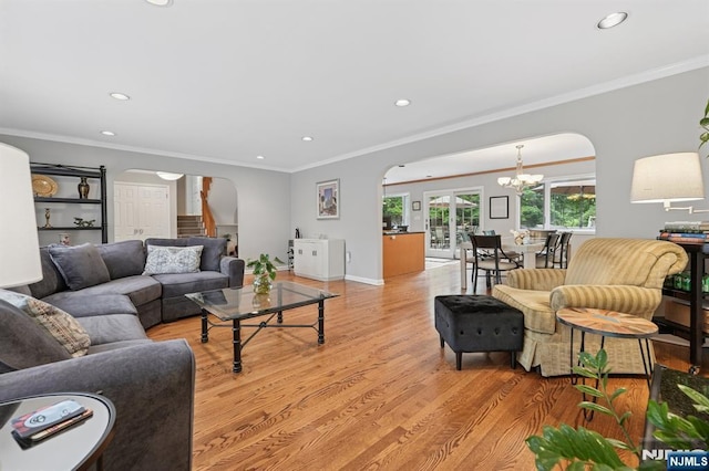 13 Stonewall Dr, Livingston, NJ 07039 - living room featuring arched walkways, a chandelier, crown molding, recessed lighting, and light wood-style floors
