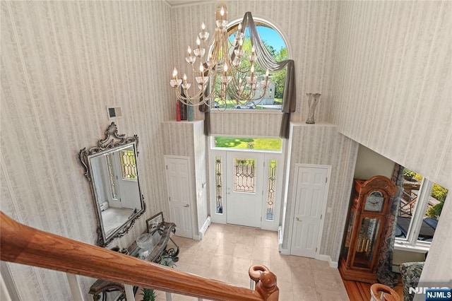 12 Woodland Ct, Wayne, NJ 07470 - entrance foyer featuring a chandelier, wallpapered walls, baseboards, and a towering ceiling