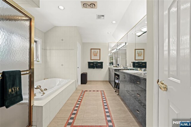 12 Woodland Ct, Wayne, NJ 07470 - full bath with vanity, a garden tub, recessed lighting, vaulted ceiling, and tile patterned flooring