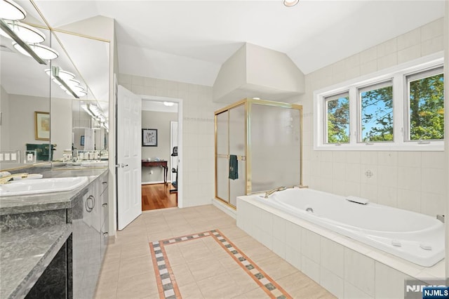 12 Woodland Ct, Wayne, NJ 07470 - bathroom with vanity, a bath, a shower stall, tile patterned floors, and vaulted ceiling