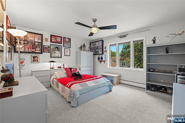 12 Woodland Ct, Wayne, NJ 07470 - bedroom with a baseboard heating unit, carpet floors, and a ceiling fan