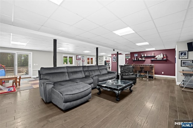 12 Woodland Ct, Wayne, NJ 07470 - living area featuring a drop ceiling, wood finished floors, a dry bar, and baseboards