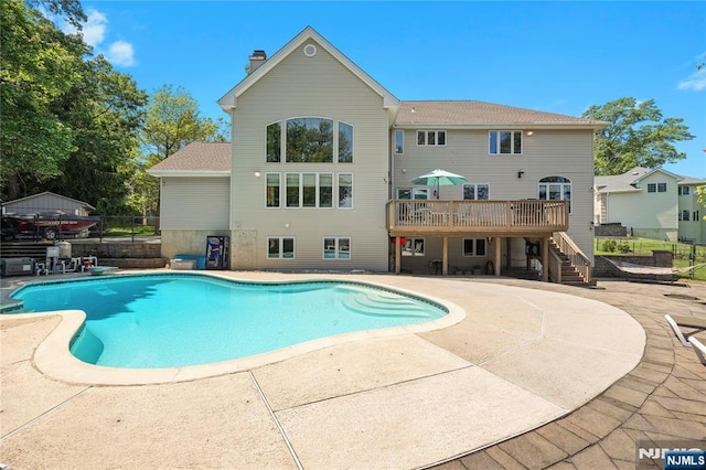 12 Woodland Ct, Wayne, NJ 07470 - view of swimming pool featuring stairs, a wooden deck, and a patio area