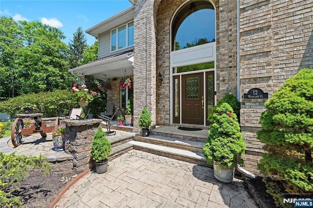 12 Woodland Ct, Wayne, NJ 07470 - entrance to property with brick siding and a patio area