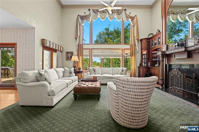 12 Woodland Ct, Wayne, NJ 07470 - living area featuring a high ceiling, a ceiling fan, ornamental molding, healthy amount of natural light, and a high end fireplace