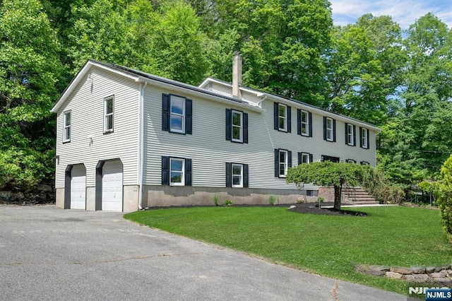 1582 Grnwd Lk, West Milford, NJ 07421 - colonial inspired home featuring a chimney, asphalt driveway, a front yard, an attached garage, and stairs