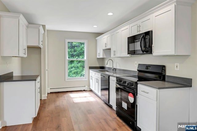 1582 Grnwd Lk, West Milford, NJ 07421 - kitchen featuring black appliances, a sink, baseboard heating, dark countertops, and recessed lighting