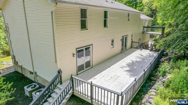 1582 Grnwd Lk, West Milford, NJ 07421 - back of property with a deck and cooling unit