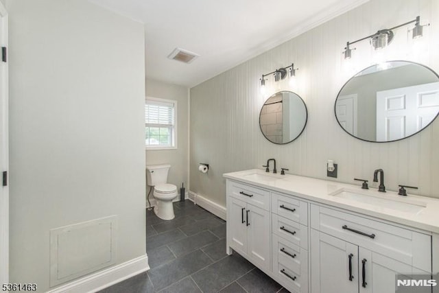5 Britton St, Netcong Borough, NJ 07857 - bathroom featuring double vanity, toilet, tile patterned flooring, and baseboards