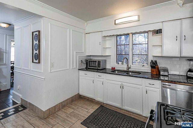 10 Whittier Ave, Trenton, NJ 08618 - kitchen with open shelves, a sink, appliances with stainless steel finishes, decorative backsplash, and ornamental molding