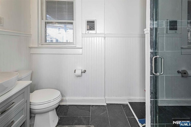 10 Whittier Ave, Trenton, NJ 08618 - full bath featuring toilet, vanity, a shower with shower door, and a wainscoted wall