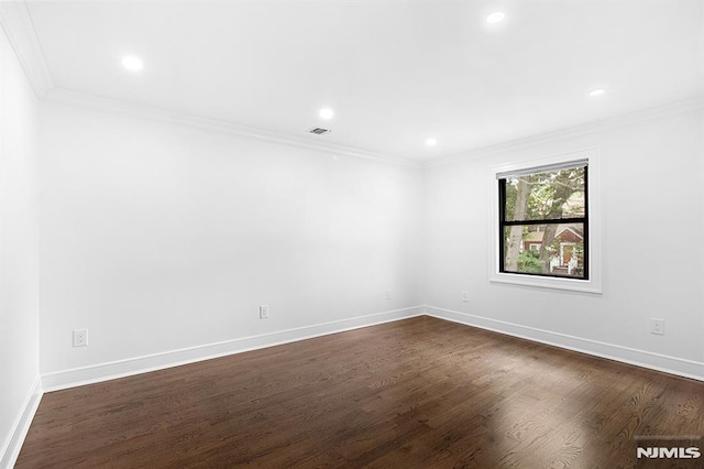 309 Clinton Ave, Bergenfield, NJ 07621 - unfurnished room featuring ornamental molding, dark wood-type flooring, and recessed lighting