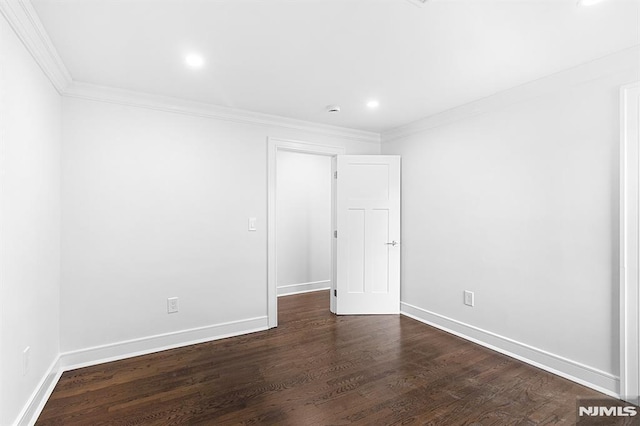 309 Clinton Ave, Bergenfield, NJ 07621 - empty room featuring ornamental molding, recessed lighting, and dark wood-style flooring