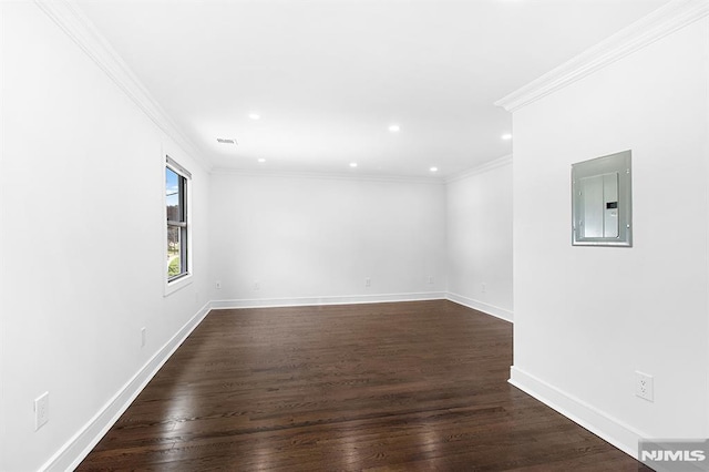 309 Clinton Ave, Bergenfield, NJ 07621 - spare room featuring electric panel, dark wood-style floors, recessed lighting, and ornamental molding