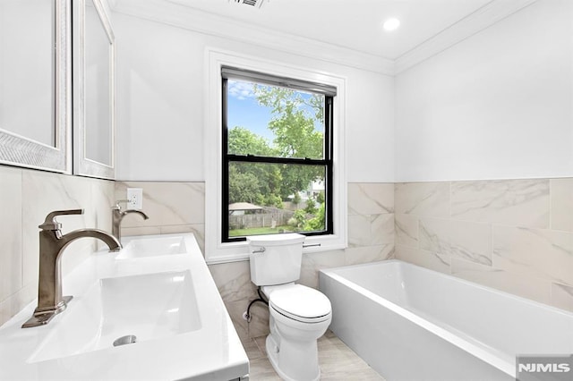 309 Clinton Ave, Bergenfield, NJ 07621 - full bath featuring tile walls, crown molding, a garden tub, and double vanity