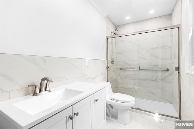 309 Clinton Ave, Bergenfield, NJ 07621 - bathroom featuring marble look tile flooring, a marble finish shower, vanity, recessed lighting, and tile walls