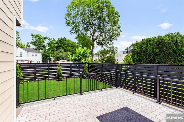 309 Clinton Ave, Bergenfield, NJ 07621 - fenced backyard with a residential view and a patio
