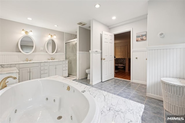 7 Meadow Ct, Midland Park, NJ 07432 - full bathroom featuring wainscoting, double vanity, a jetted tub, a shower stall, and recessed lighting