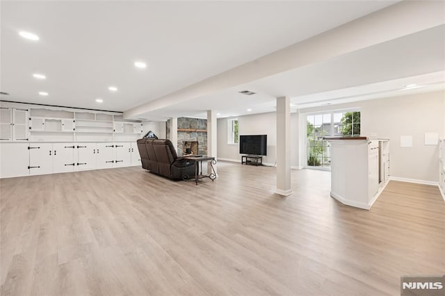 7 Meadow Ct, Midland Park, NJ 07432 - living area with light wood finished floors, a fireplace, and recessed lighting