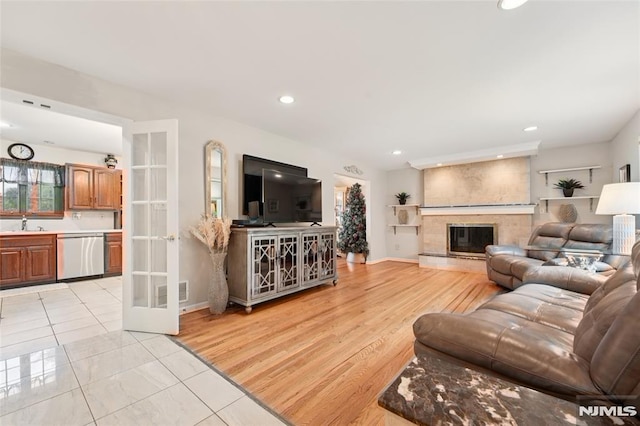 7 Meadow Ct, Midland Park, NJ 07432 - living area with recessed lighting, a fireplace, french doors, and light tile patterned floors