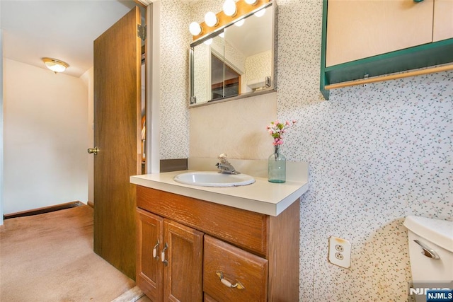 41 Gillies St, Clifton, NJ 07013 - bathroom with vanity, toilet, and wallpapered walls