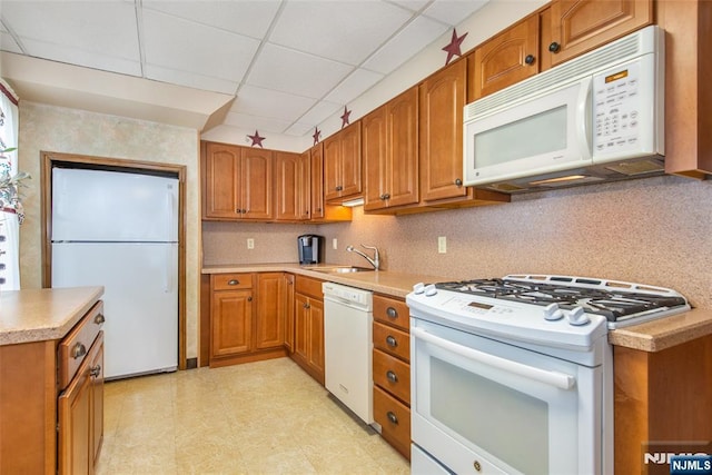 41 Gillies St, Clifton, NJ 07013 - kitchen featuring white appliances, a sink, a paneled ceiling, brown cabinets, and light countertops