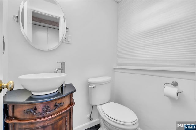 8 Delmar Ave, Cresskill, NJ 07626 - bathroom featuring vanity, toilet, and baseboards