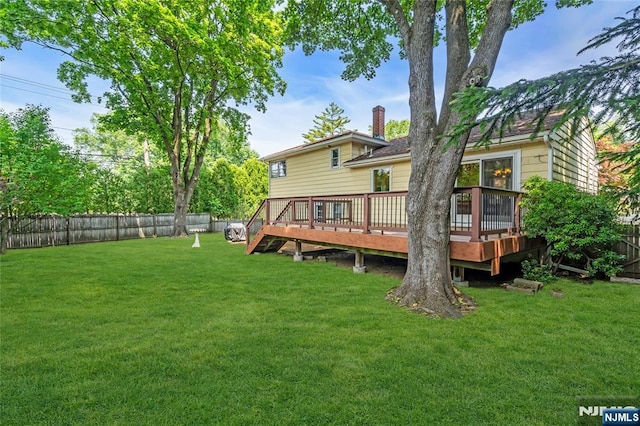 8 Delmar Ave, Cresskill, NJ 07626 - back of property featuring a deck and a chimney