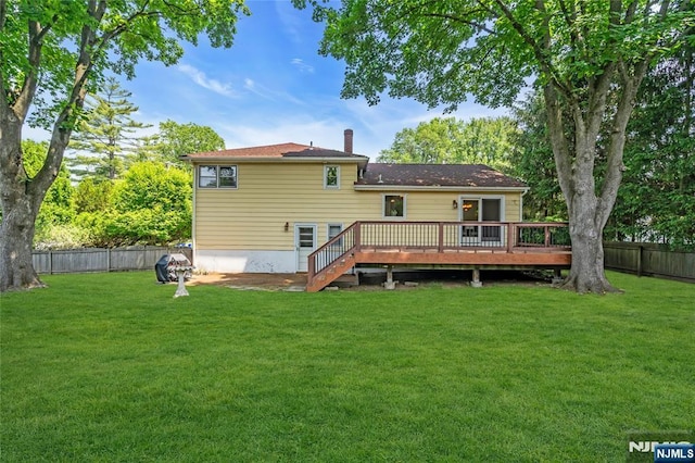8 Delmar Ave, Cresskill, NJ 07626 - rear view of property featuring a wooden deck and a chimney