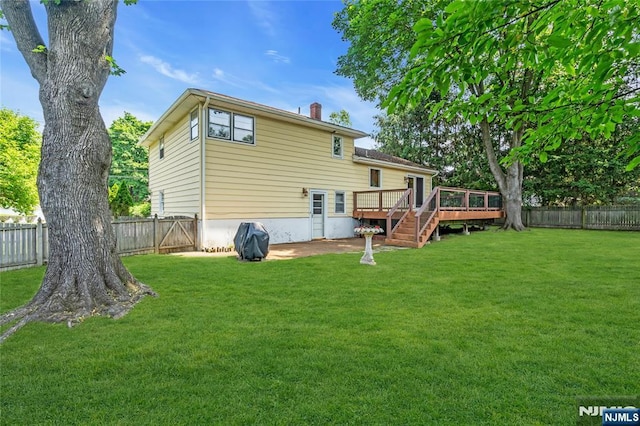 8 Delmar Ave, Cresskill, NJ 07626 - rear view of property featuring a wooden deck and a chimney