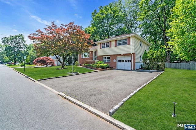 8 Delmar Ave, Cresskill, NJ 07626 - tri-level home with asphalt driveway, a garage, and brick siding