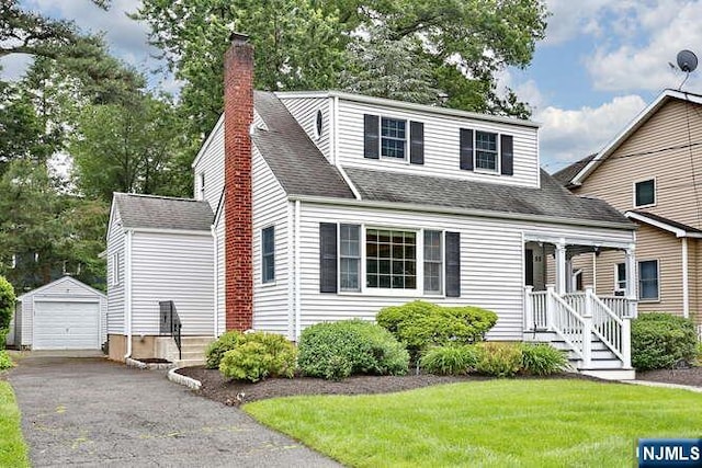 55 Beech St, Westwood, NJ 07675 - view of front of home with an outbuilding, a garage, a chimney, a front lawn, and a shingled roof
