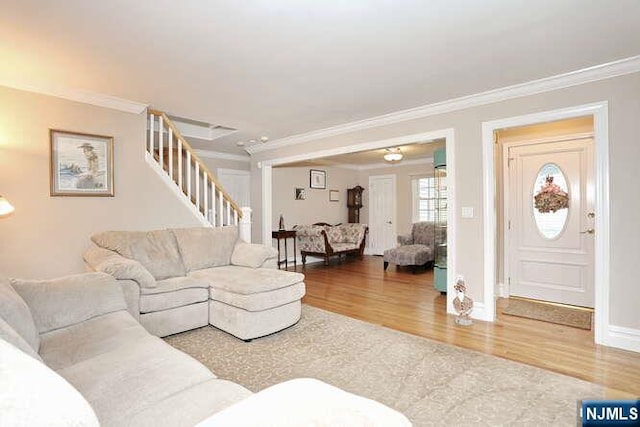 55 Beech St, Westwood, NJ 07675 - living room with wood finished floors, crown molding, and stairs