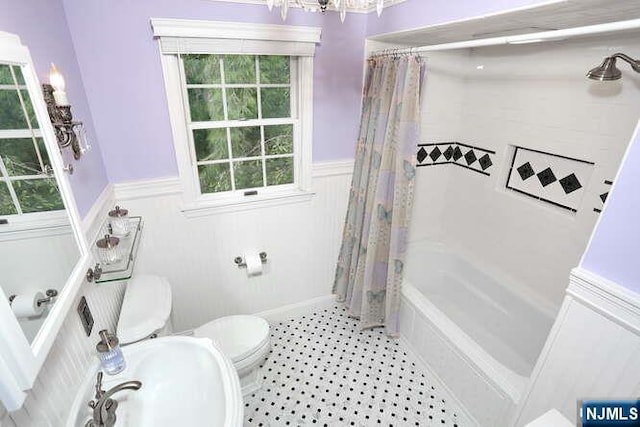 55 Beech St, Westwood, NJ 07675 - bathroom featuring wainscoting, shower / tub combo with curtain, a decorative wall, tile patterned floors, and a chandelier