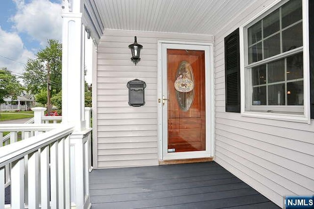 55 Beech St, Westwood, NJ 07675 - view of exterior entry featuring a porch