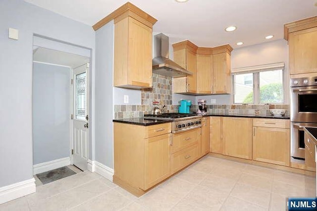 55 Beech St, Westwood, NJ 07675 - kitchen featuring wall chimney range hood, light brown cabinetry, stainless steel appliances, tasteful backsplash, and dark countertops