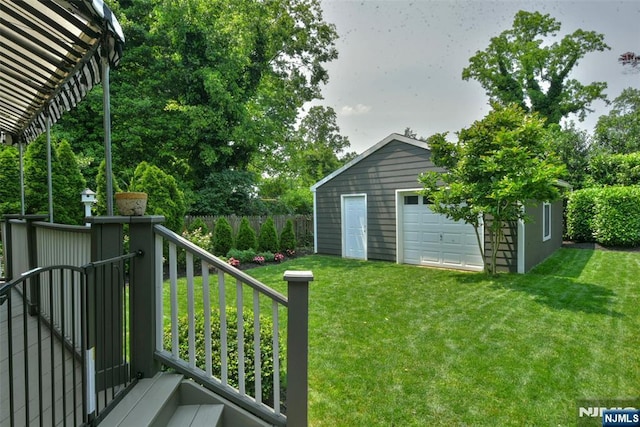  - view of yard with a garage and an outbuilding