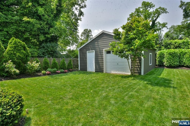  - view of yard featuring an outbuilding and a detached garage
