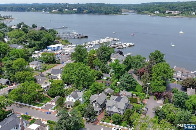  - aerial view of residential area featuring a large body of water