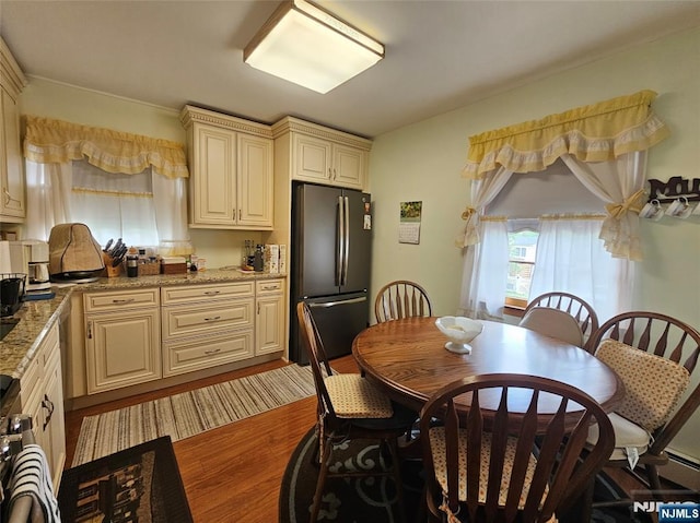 37 Pocohontas Path, Lincoln Park Borough, NJ 07035 - kitchen featuring freestanding refrigerator, cream cabinets, wood finished floors, and light stone counters