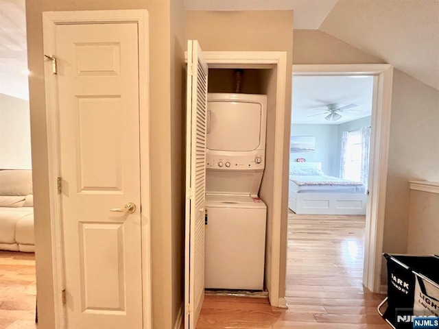 200 Dey St Unit 283, Harrison, NJ 07029 - washroom with stacked washer / dryer, light wood-type flooring, and ceiling fan