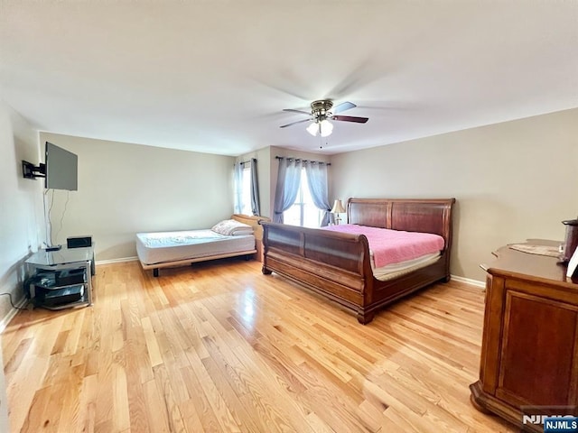 200 Dey St Unit 283, Harrison, NJ 07029 - bedroom featuring light wood-type flooring and a ceiling fan