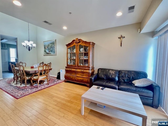 200 Dey St Unit 283, Harrison, NJ 07029 - living room featuring a chandelier, light wood-style floors, and recessed lighting