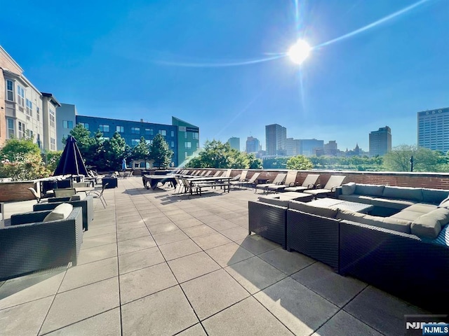 200 Dey St Unit 283, Harrison, NJ 07029 - view of patio / terrace featuring outdoor lounge area and a view of city
