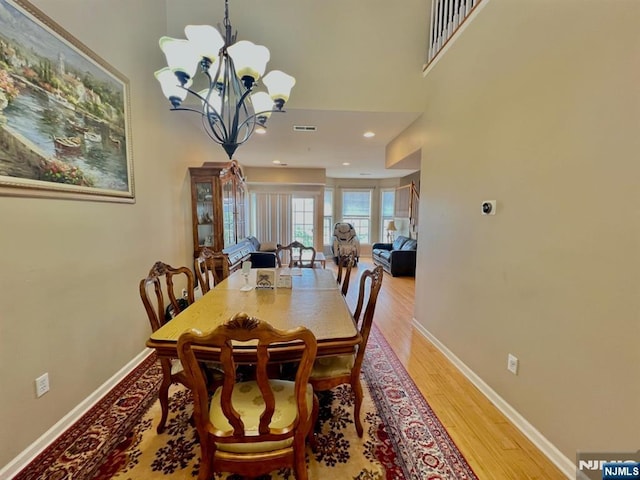 200 Dey St Unit 283, Harrison, NJ 07029 - dining area with a chandelier and light wood-type flooring