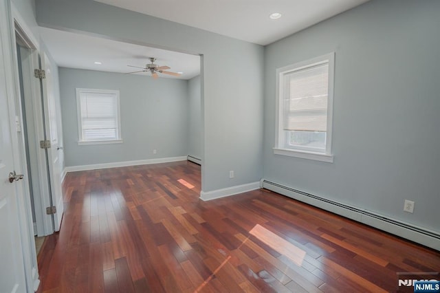 42 Berton Pl, Nutley, NJ 07110 - spare room with a baseboard heating unit, healthy amount of natural light, dark wood-style flooring, and recessed lighting
