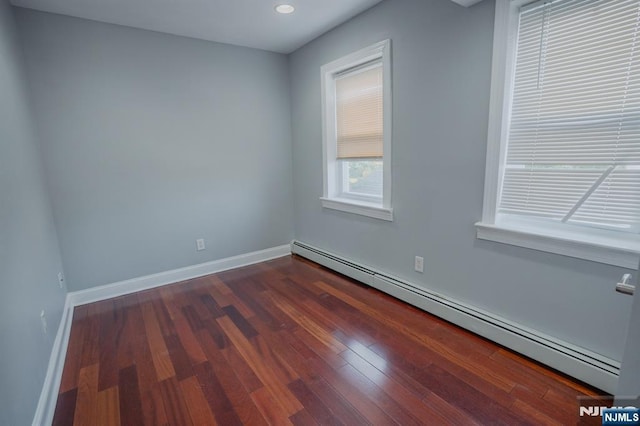 42 Berton Pl, Nutley, NJ 07110 - empty room with baseboard heating, dark wood finished floors, baseboards, and recessed lighting