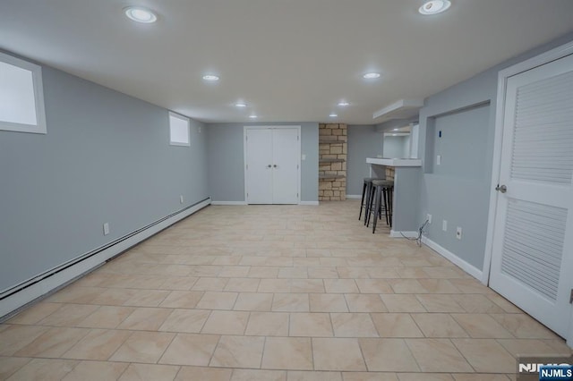 42 Berton Pl, Nutley, NJ 07110 - basement with a baseboard heating unit, recessed lighting, and baseboards